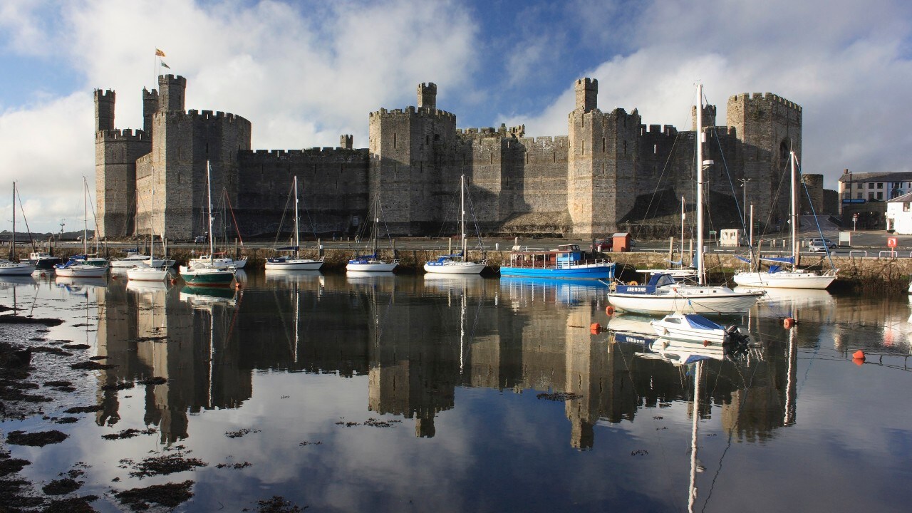 Caernarfon Castle reflected in the water