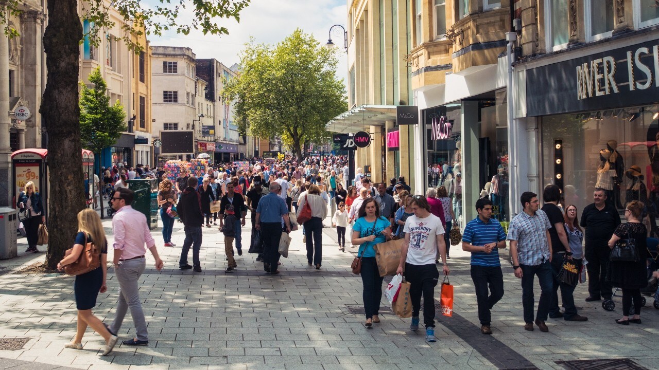 Shoppers on Queens street in Cardiff on a sunny day